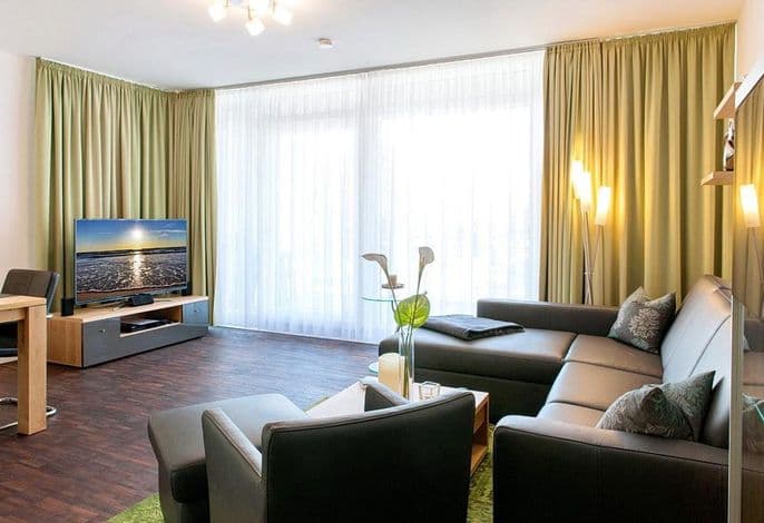 Hochwertiges Familienapartment mit großem Balkon, Whirlbadewanne und Kaminofen
