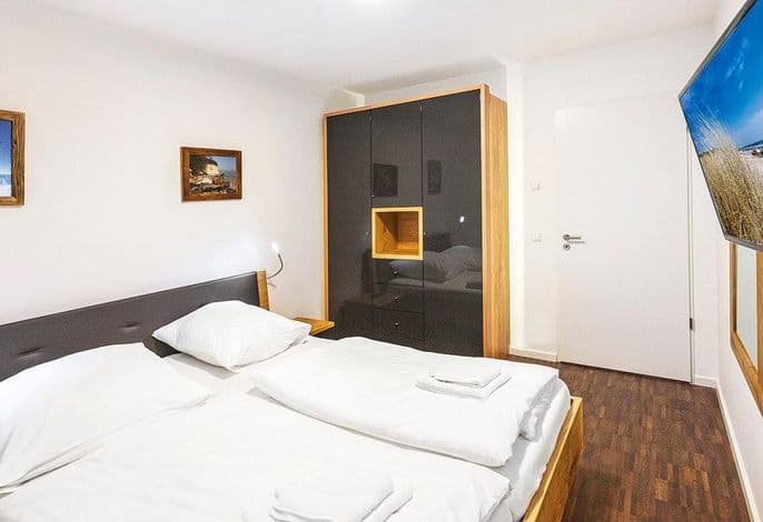 Hochwertiges Familienapartment mit großem Balkon, Whirlbadewanne und Kaminofen - DünenResort Binz detail 4