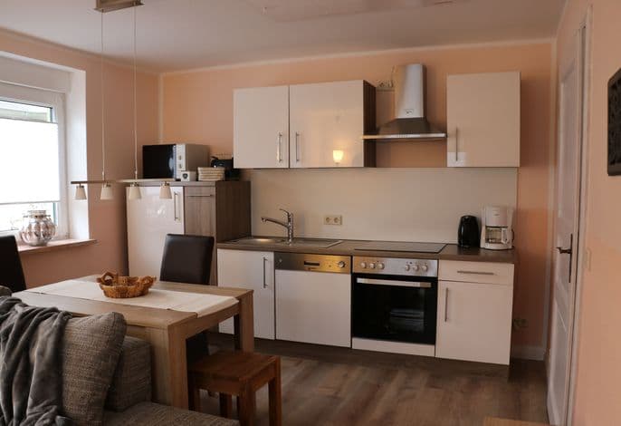 Ferienwohnung Garten - Frühstück in der Morgensonne - Ferienwohnungen Polchow - direkt am Wasser detail 1