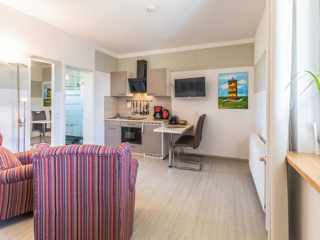 02 Ferienwohnung am Deich mit Terrasse - schöne Ferienwohnungen zwischen Deich und Wellen detail 1